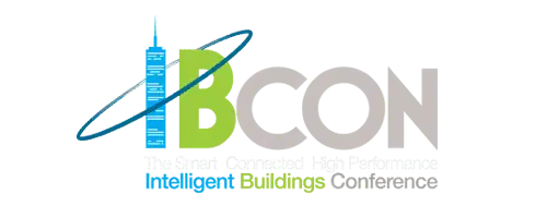 Logo for IBCon featuring a blue skyscraper as the letter “I” with a ring orbiting it, next to green letters “B” and gray “CON.” Below, it says “Intelligent Buildings Conference” in blue and green text.